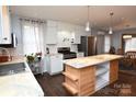 Updated kitchen featuring white shaker cabinets, stainless steel appliances, and a center island at 198 Clouse Ln, Taylorsville, NC 28681