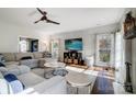 Sun-drenched living room featuring a sectional sofa and hardwood floors at 19906 Catamaran Ct, Cornelius, NC 28031