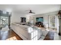 Sun-drenched living room featuring a sectional sofa and hardwood floors at 19906 Catamaran Ct, Cornelius, NC 28031