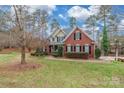 Two-story house with a front yard and a walkway at 2044 Chameleon Rd, York, SC 29745