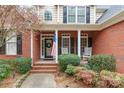 Front porch with rocking chairs and a wreath on the door at 2044 Chameleon Rd, York, SC 29745