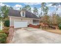 Two-car garage with a screened porch and a backyard at 2044 Chameleon Rd, York, SC 29745