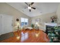 Cozy living room with hardwood floors, fireplace, and a vaulted ceiling at 2935 Dairy Farm Dr, Monroe, NC 28110