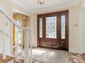 Inviting foyer featuring a beautiful front door, neutral paint and tile flooring at 3041 Valencia Ter, Charlotte, NC 28211