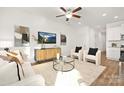 Open concept living area with modern furniture and kitchen view at 3108 Amay James Ave, Charlotte, NC 28208