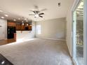 Spacious living room with fireplace and access to patio at 5052 Haven Lodge Rd, Matthews, NC 28104