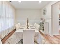 Elegant dining room with wainscoting, stylish lighting, and seating for six at 5057 Spratt Rd, York, SC 29745