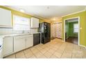 Bright kitchen with white cabinets and granite countertops at 6816 Idlewild Rd, Charlotte, NC 28212