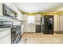 Bright kitchen with white cabinets and granite countertops at 6816 Idlewild Rd, Charlotte, NC 28212