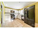 Bright kitchen with white cabinets and granite countertops at 6816 Idlewild Rd, Charlotte, NC 28212