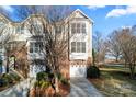 Well-maintained townhome with 2-car garage and mature trees at 804 Skybrook Falls Dr, Huntersville, NC 28078