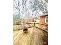 Wooden deck with lattice sides and wicker chair at 901 Maple Ave, Salisbury, NC 28144