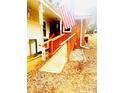 Accessible front porch with ramp and American flag at 901 Maple Ave, Salisbury, NC 28144