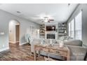 Living room with fireplace, hardwood floors, and access to hallway at 1026 Slew O Gold Ln, Indian Trail, NC 28079