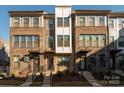 Modern townhome with brick exterior and inviting front porch at 1326 Gleason Way, Charlotte, NC 28217