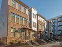 Townhomes with brick and siding exteriors, and landscaping at 1326 Gleason Way, Charlotte, NC 28217