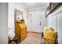 Bright entryway with decorative yellow secretary and bench at 1542 Colony Rd, Rock Hill, SC 29730