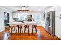 Modern kitchen featuring white cabinets, a large island, and stainless steel appliances at 1542 Colony Rd, Rock Hill, SC 29730