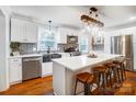 Modern kitchen featuring white cabinets, a large island, and stainless steel appliances at 1542 Colony Rd, Rock Hill, SC 29730