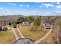 Aerial view of a quiet neighborhood with houses and cul-de-sac at 160 Pampas Ln, Mooresville, NC 28117