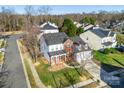 Aerial view of a two-story house in a residential neighborhood at 2003 Galty Ln, Charlotte, NC 28270