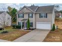 Two-story house with a neutral color scheme and a two-car garage at 2033 Roscommon Dr, Clover, SC 29710