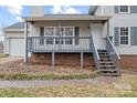 Gray porch with brick base and stairs leading to the front door at 212 King George Ln, Gastonia, NC 28056