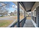 View from the front porch showing a quiet residential street at 212 King George Ln, Gastonia, NC 28056