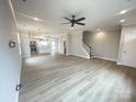 Spacious open-plan living area flows to a well-lit modern kitchen at 266 Gilead Rd, Huntersville, NC 28078