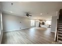 Expansive open-concept living space showcasing modern wood-look floors and abundant natural light at 266 Gilead Rd, Huntersville, NC 28078