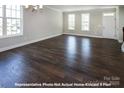 Bright living room with hardwood floors and ample natural light at 266 Gilead Rd, Huntersville, NC 28078