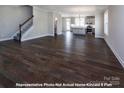 Spacious living room featuring hardwood floors and an open floor plan at 266 Gilead Rd, Huntersville, NC 28078