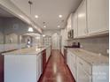 Modern kitchen with granite countertops and stainless steel appliances at 2836 Santiago Cir, Monroe, NC 28110