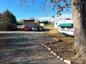 Large parking area with multiple vehicles and a shed at 4126 Oxford School Rd, Catawba, NC 28609