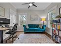 Bright home office space with teal couch and built-in bookshelves at 423 Solomon St, Charlotte, NC 28216