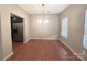 Spacious dining area with hardwood floors and chandelier at 435 Battery Cir, Clover, SC 29710