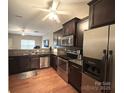 Modern kitchen featuring dark cabinetry and stainless steel appliances at 435 Battery Cir, Clover, SC 29710