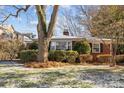 Brick Ranch home with snowy front yard and large tree at 4419 Halstead Dr, Charlotte, NC 28209