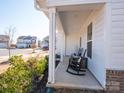 Front porch with rocking chairs, offering a relaxing outdoor space at 450 Caleb St, Monroe, NC 28110