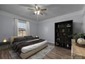 Cozy bedroom features a plush bed, stylish shelving, and soft lighting for a relaxing ambiance at 535 5Th St, Chester, SC 29706