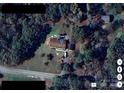 Aerial view of the property showing the lot, landscaping, and surrounding trees at 6615 Love Mill Rd, Monroe, NC 28110