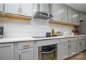 Modern kitchen with gray cabinets and stainless steel appliances at 6615 Love Mill Rd, Monroe, NC 28110