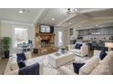 Inviting living room featuring a stone fireplace, vaulted ceilings, and open floor plan at 6615 Love Mill Rd, Monroe, NC 28110