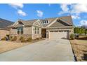 Brick ranch home with attached garage and landscaped yard at 9428 Liberty Hill Dr, Mint Hill, NC 28227