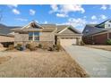 Attractive single-Gathering home featuring a well-manicured lawn and inviting curb appeal at 9428 Liberty Hill Dr, Mint Hill, NC 28227