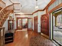 Hardwood floors, hexagonal tile, and views to the dining room and porch at 955 Brafford Dr, Concord, NC 28025