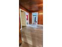 Hallway with wood-look floors, leading to bedrooms and kitchen at 3706 2Nd Nw Ave, Hickory, NC 28601