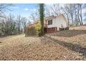 Back of house showing deck and wooded surroundings at 522 State St, Lincolnton, NC 28092