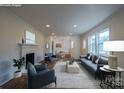 Bright and staged living room with a fireplace, hardwood floors, and plenty of natural light at 6305 Dale Ave, Charlotte, NC 28212