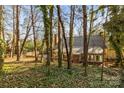 House nestled in a wooded backyard with a large deck at 69 Honeysuckle Woods, Clover, SC 29710